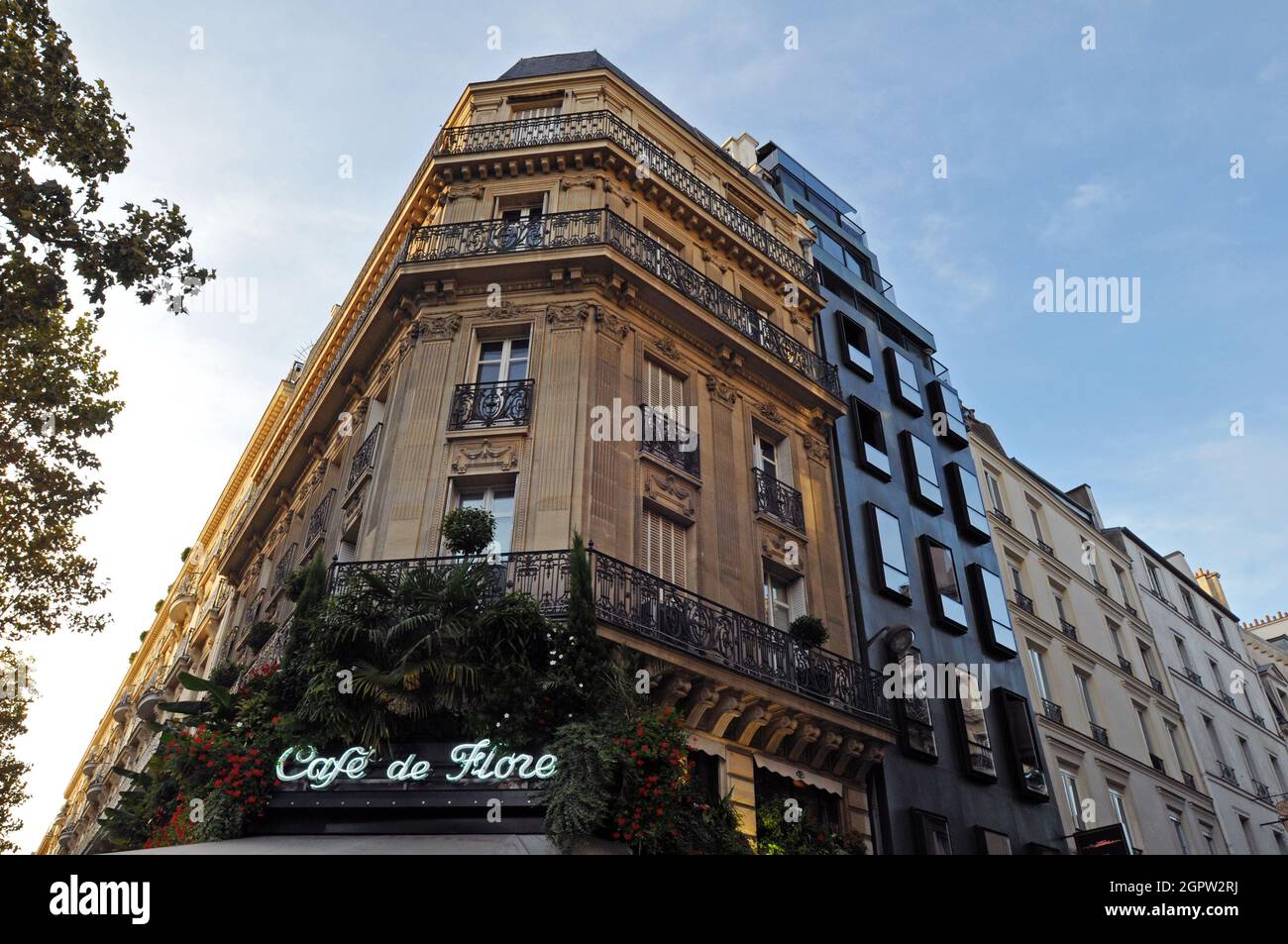 The corner building housing Café de Flore, a famous coffeehouse popular with tourists in the Saint-Germain-des-Prés area of Paris. Stock Photo
