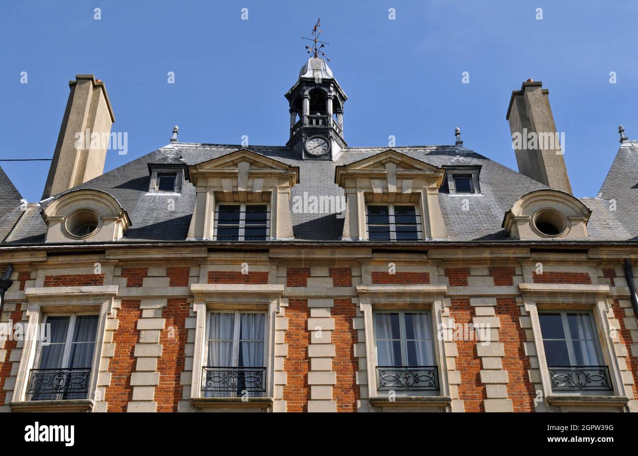 Detail of one of the pavilions fronting onto historic Place des Vosges in the Marais district in Paris. Grand residences line the public square. Stock Photo