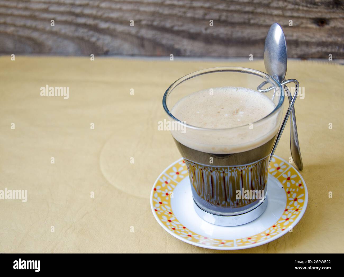 Close-up Of Glass Of Coffee On Table Stock Photo