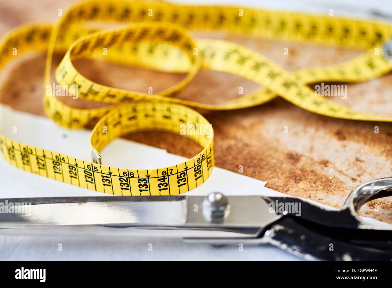 close-up of a yellow tailor's tape measure Stock Photo