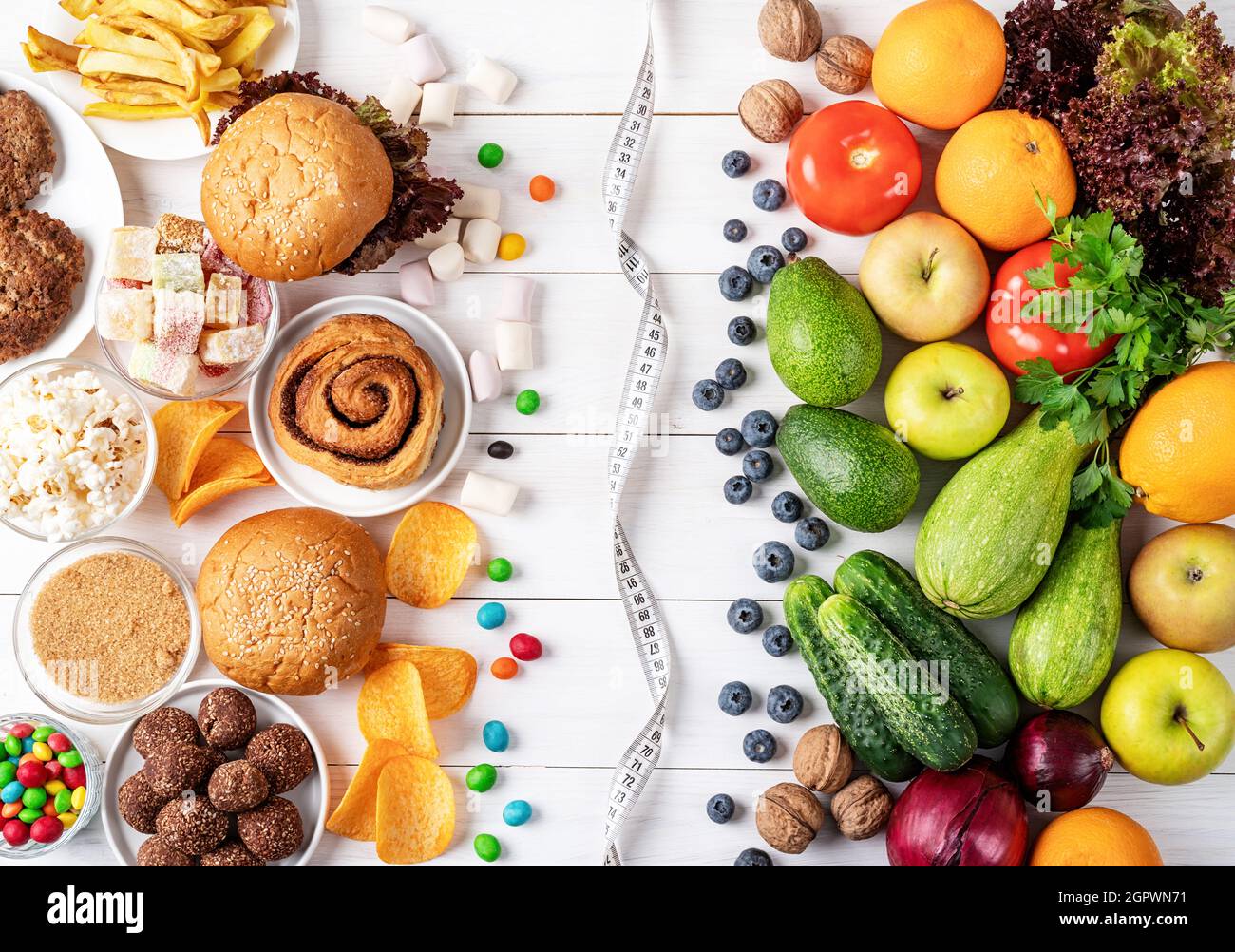 Healthy And Unhealthy Food Concept. Fruit And Vegetables Vs Sweets And