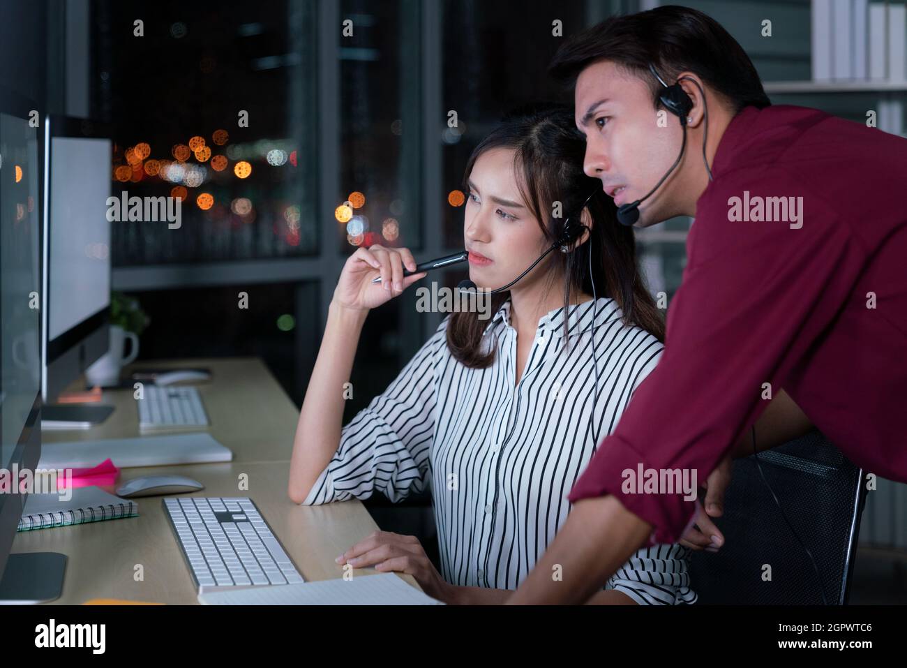 Young Thai Asian Customer Services Care Operators Working Night Shift