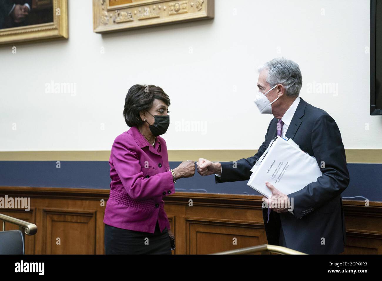 Washington, United States. 30th Sep, 2021. Representative Maxine Waters (D-CA), chairwoman of the House Financial Services Committee, greets Federal Reserve Chairman Jerome Powell following a House Financial Services Committee hearing on oversight of the Treasury Department and Federal Reserve coronavirus pandemic response on Capitol Hill in Washington, DC on Thursday September 30, 2021. Photo by Sarah Silbiger/UPI Credit: UPI/Alamy Live News Stock Photo