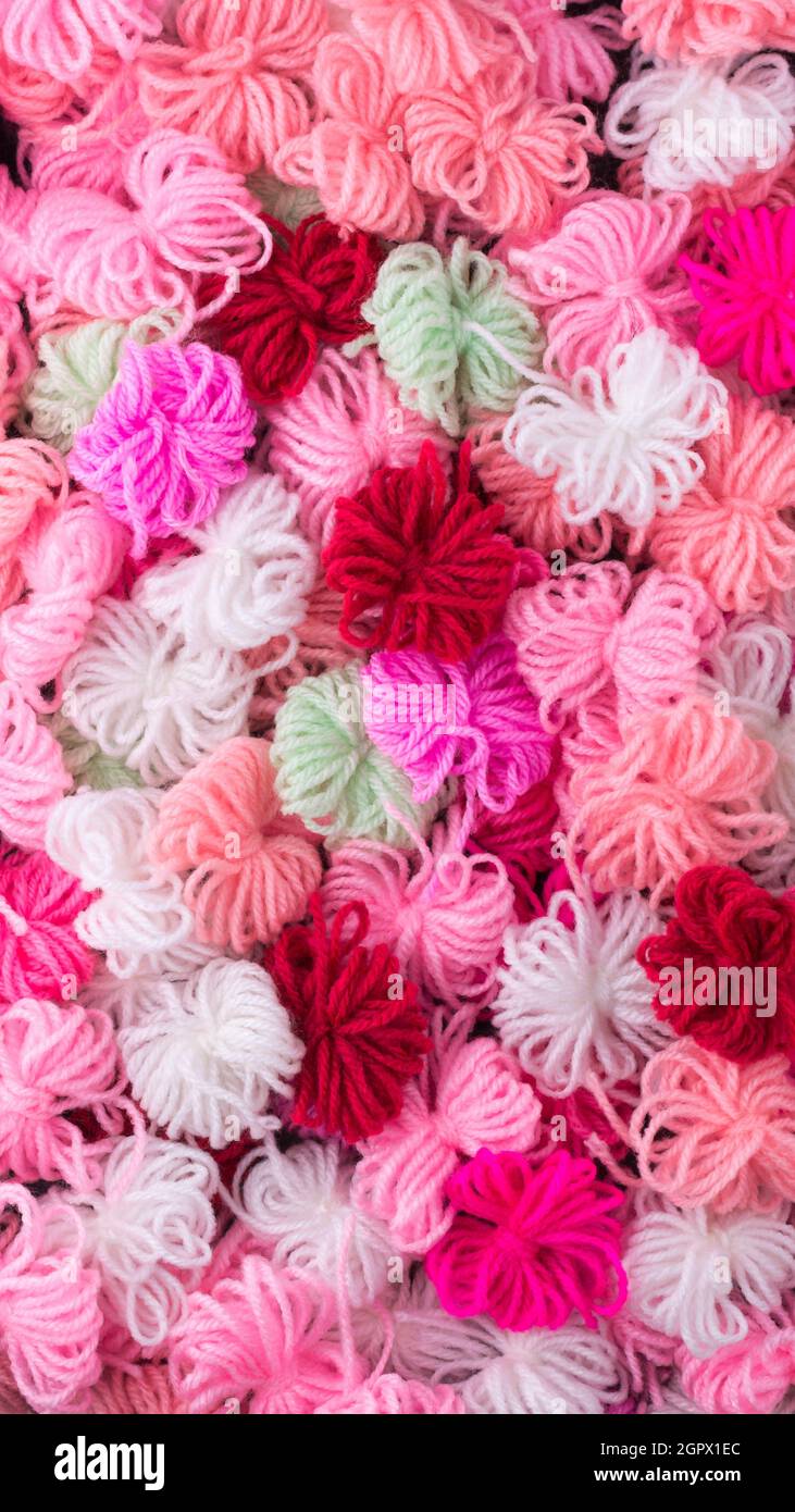 knitted wool flowers abstract, colorful woven yarn background texture ...