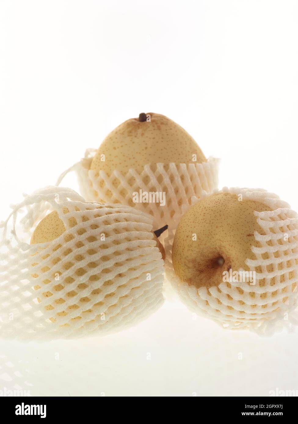 Food/fruit still life of Chinese white pear, Pyrus × bretschneideri, on plain background Stock Photo