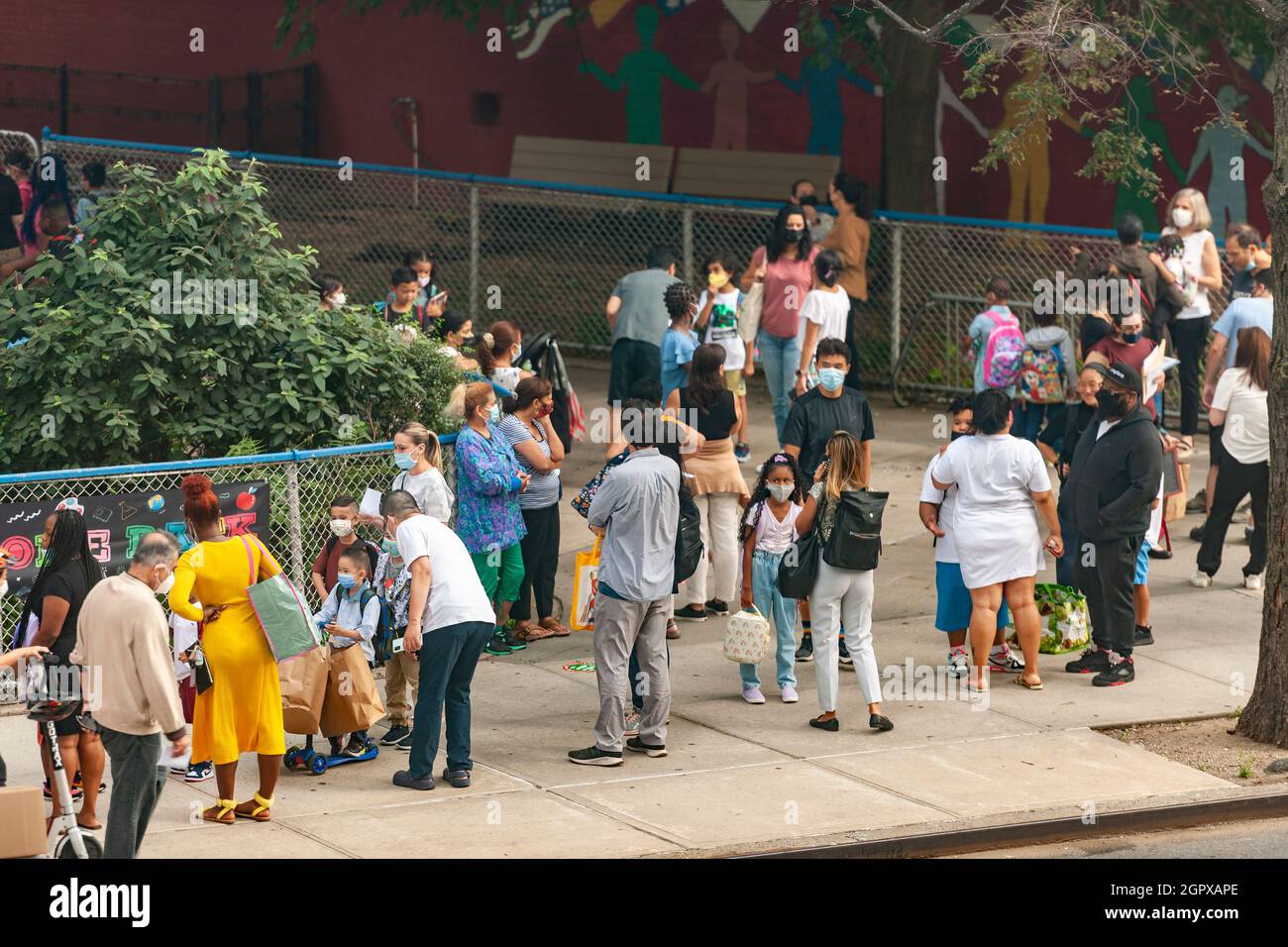 Parents and students line up outside of PS33 in Chelsea in New York on the first day of school, Monday, September 13, 2021. New York City has mandated no remote option this school year instituting precautions to prevent the spread of COVID-19 in the classroom. (© Richard B. Levine) Stock Photo