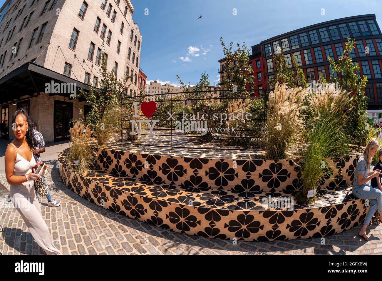 Fashionistas and the common public participate in the Kate Spade “Apple  Orchard” for New York Fashion Week in the Meatpacking District of New York  on Friday, September 10, 2021. Participants could pick