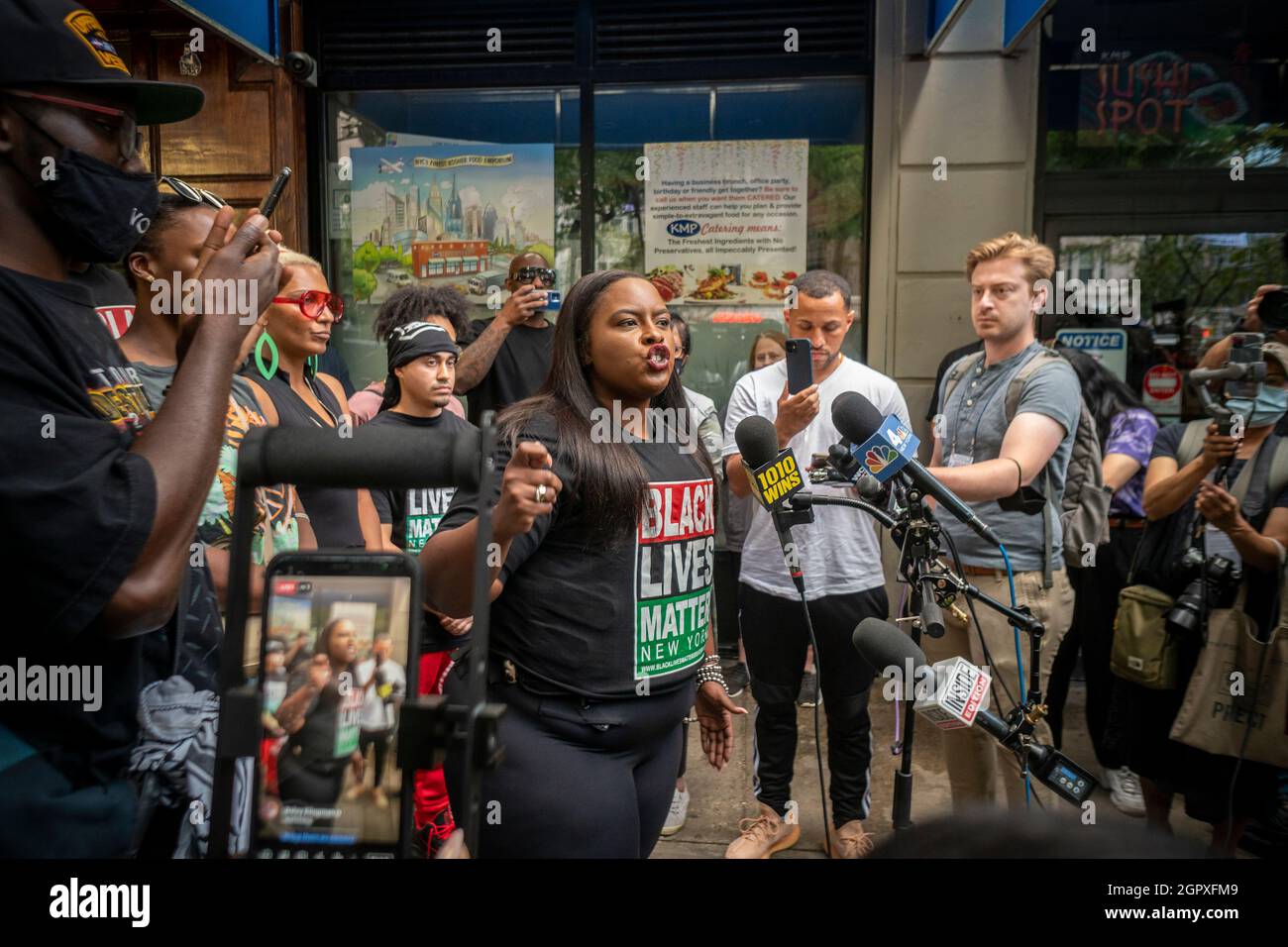 Black Lives Matter Greater New York co-founder Chivona Newsome speaks to the assembled media outside of Carmine’s Restaurant in the Upper West Side neighborhood of New York on Monday, September 20, 2021 about the alleged racially charged incident involving black customers and the hostess of the restaurant.  (© Richard B. Levine) Stock Photo