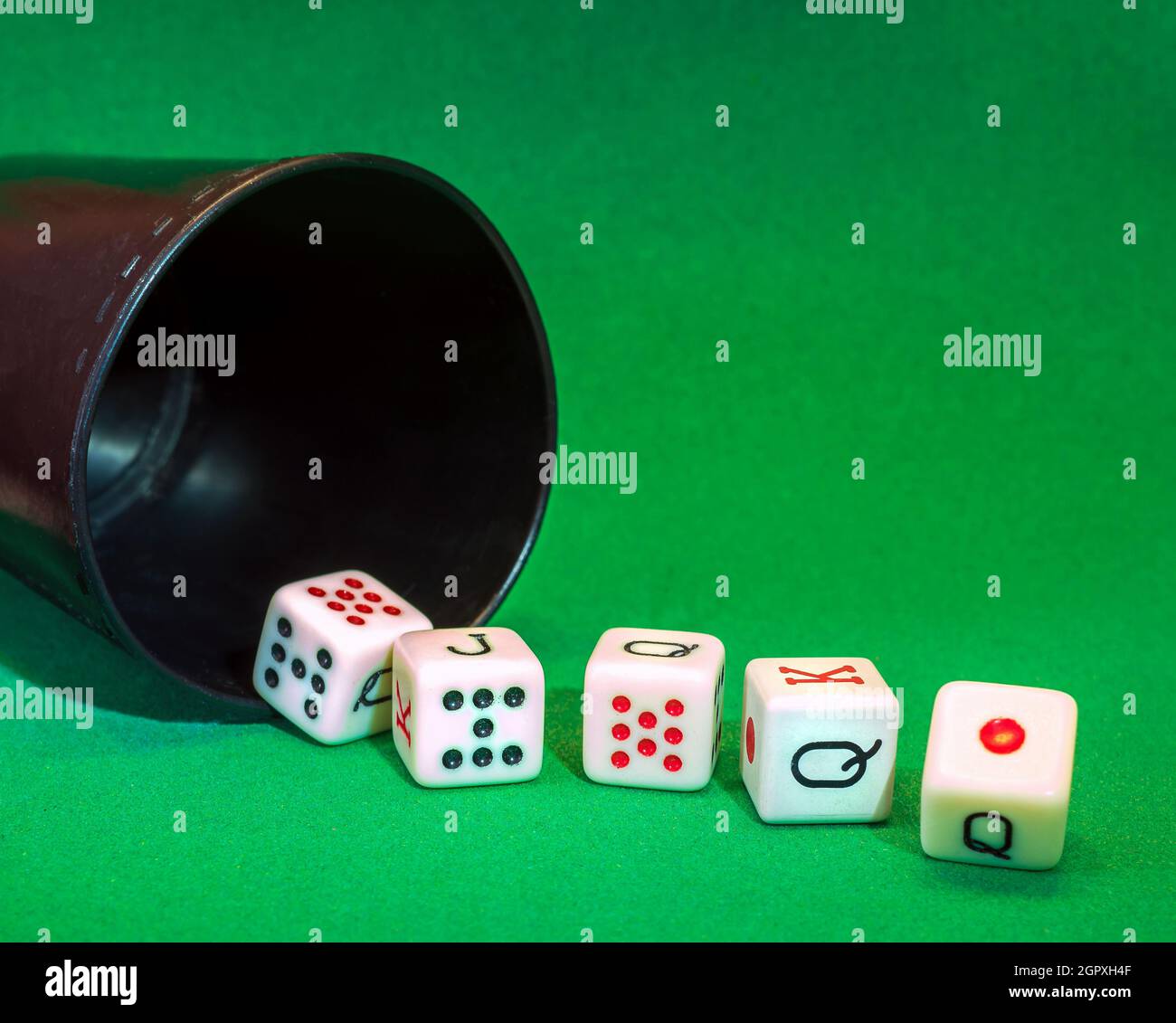 A Royal Flush By Poker Dice On The Green Table. Stock Photo