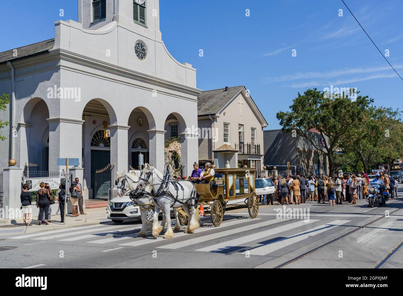 NEW ORLEANS, LA, USA -SEPTEMBER 25, 2021: Funeral gathering following jazz funeral parade at Our Lady of Guadalupe Church on Rampart Street Stock Photo