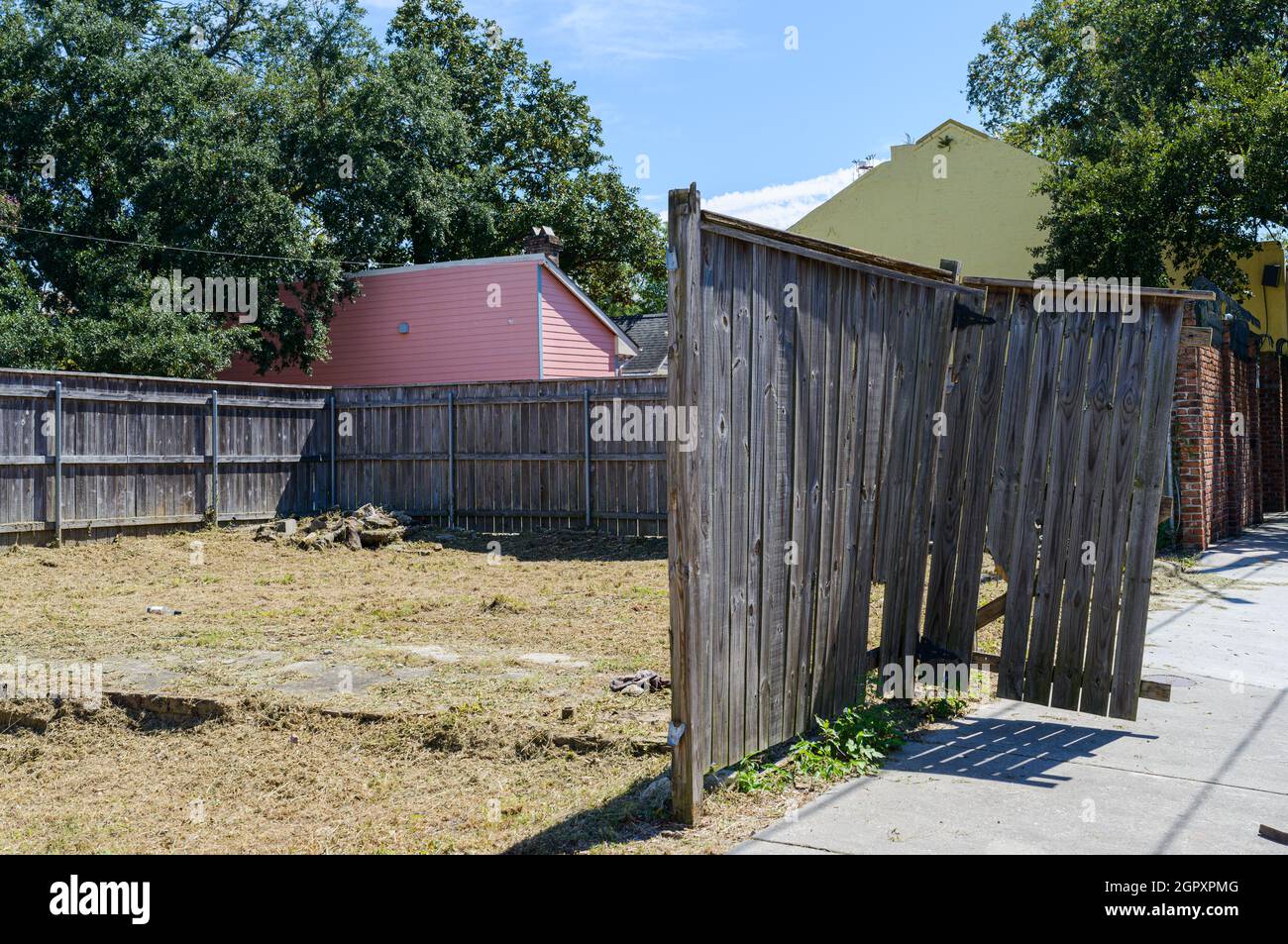 NEW ORLEANS, LA, USA -  SEPTEMBER 25, 2021: Remnants of fence impacted by the winds of Hurricane Ida in Treme Neighborhood Stock Photo