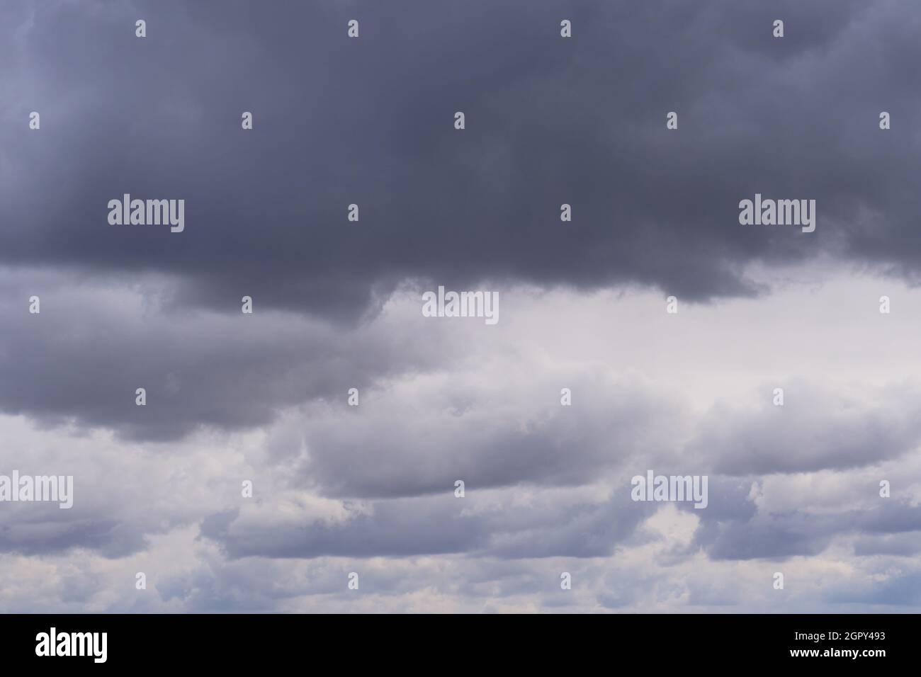 Background, storm clouds illuminated by sunlight Stock Photo
