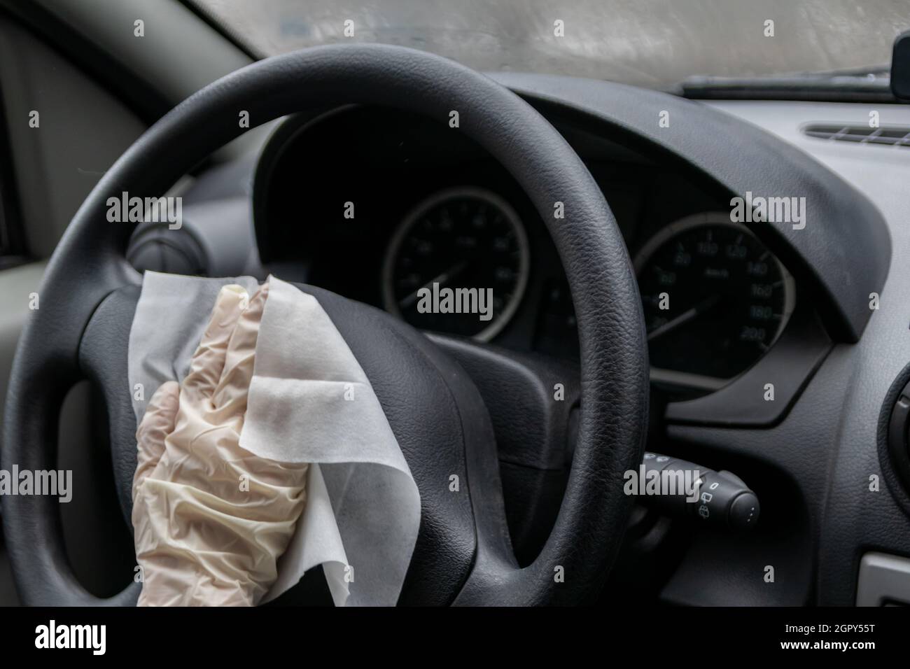 Child Hand In Rubber Glove Disinfects Car Cockpit As Infection Control And Infection Prevention Stock Photo