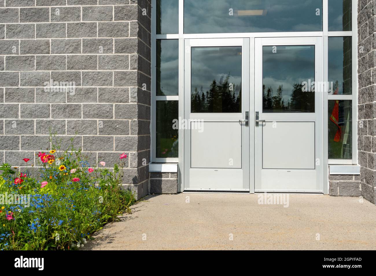Double commercial exterior steel doors of a business. The glass is on