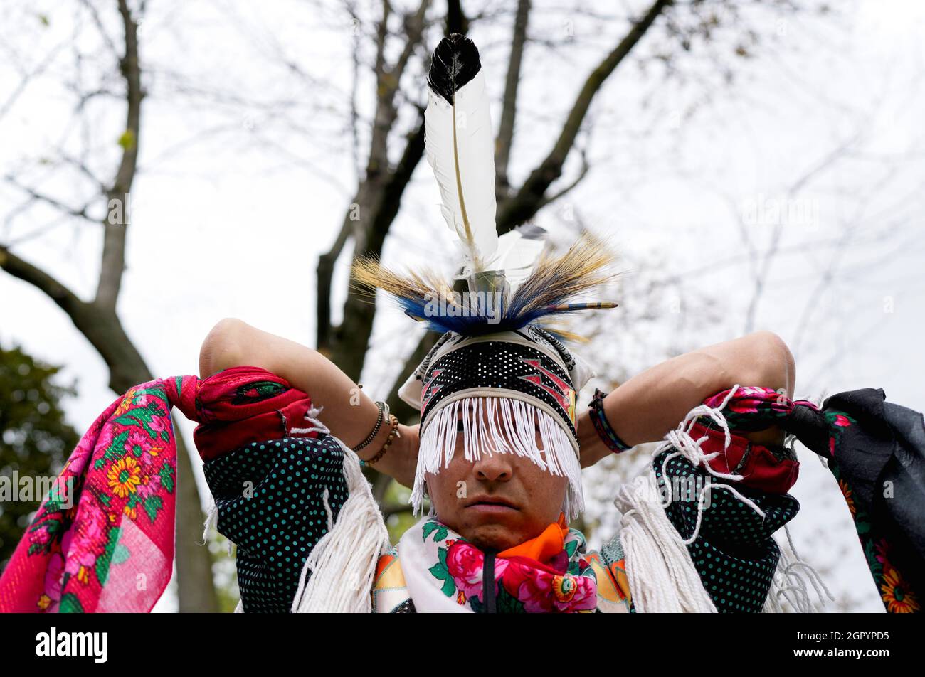 Chris Mejaki, from Wikwemikong Unceded First Nation, wears grass dance