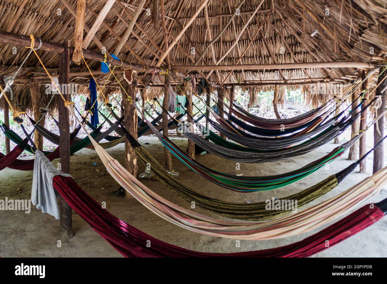 Hammocks hang in a hut in Tayrona National Park, Colombia Stock Photo