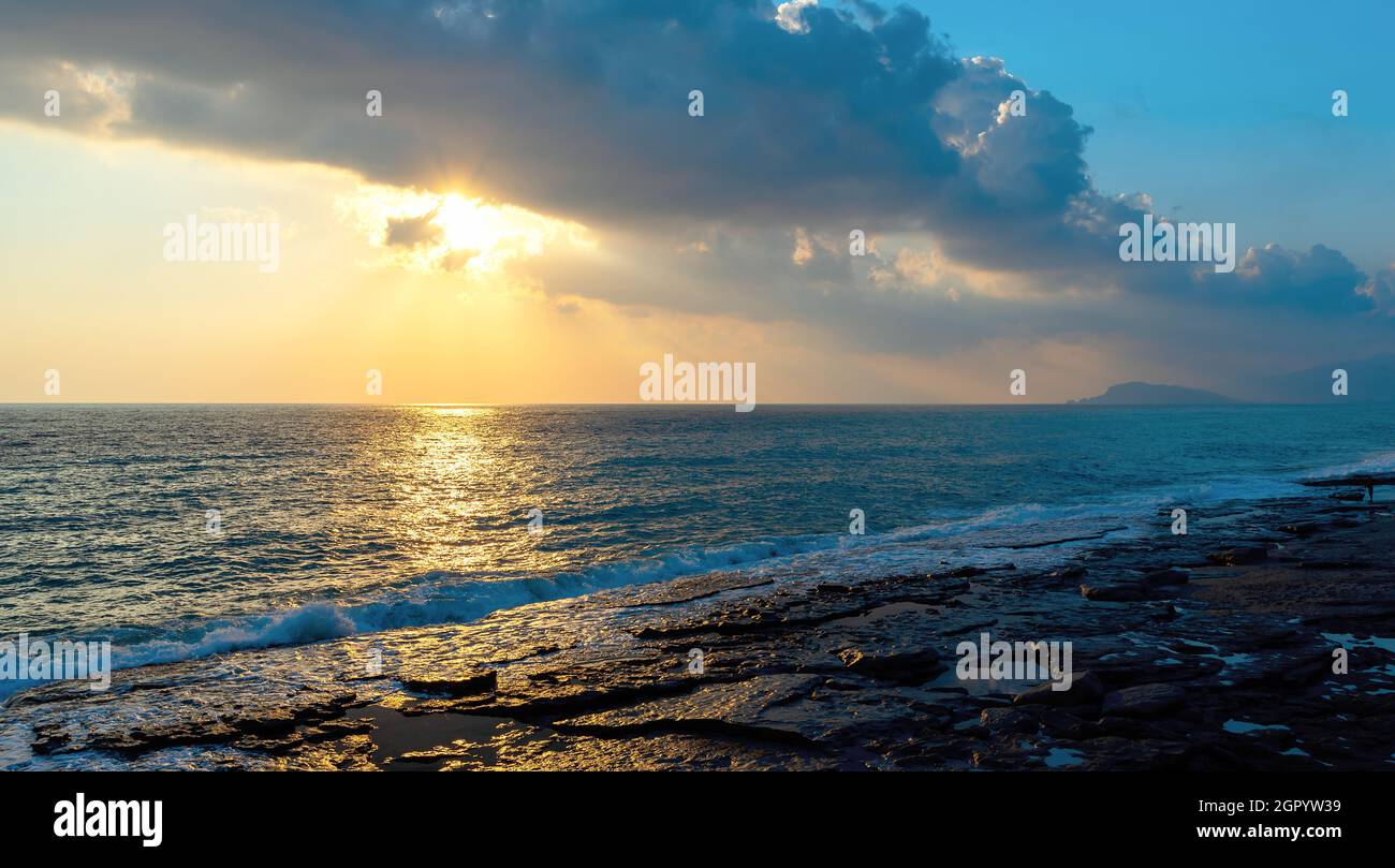 Beautiful setting sun over the mediterranean sea in Mahmutlar, Turkey Stock Photo