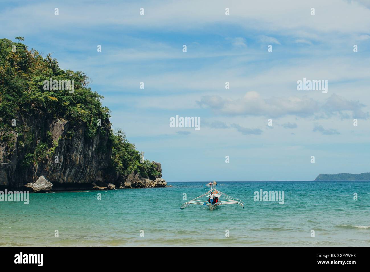 BOAT FLOATING ON THE SEA ON  SOUTH EAST ASIA Stock Photo