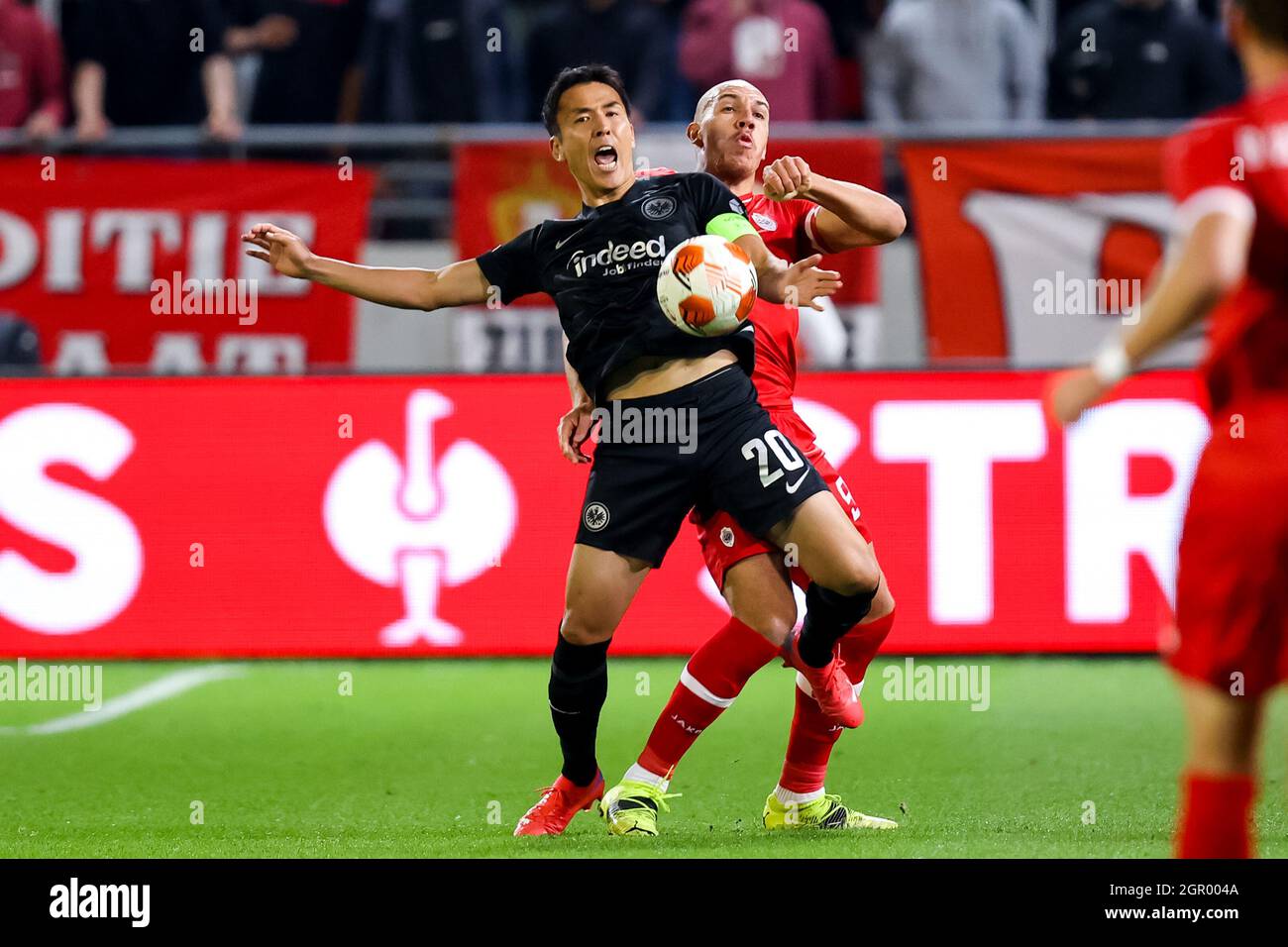ANTWERP, BELGIUM - SEPTEMBER 30: Makoto Hasebe of Eintracht Frankfurt and Michael Frey of Royal Antwerp FC battle for possession during the UEFA Europa League Group Stage match between Royal Antwerp FC and Eintracht Frankfurt at the Bosuil on September 30, 2021 in Antwerp, Belgium (Photo by Herman Dingler/Orange Pictures) Stock Photo