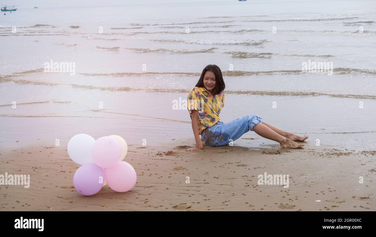 Woman dancing beach jeans hi-res stock photography and images - Alamy