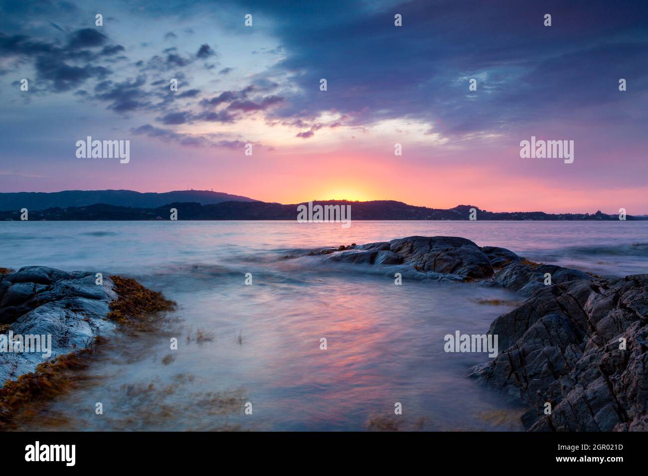 Sunset over sea in west Norway. Norwegian coast in Bergen. Stock Photo