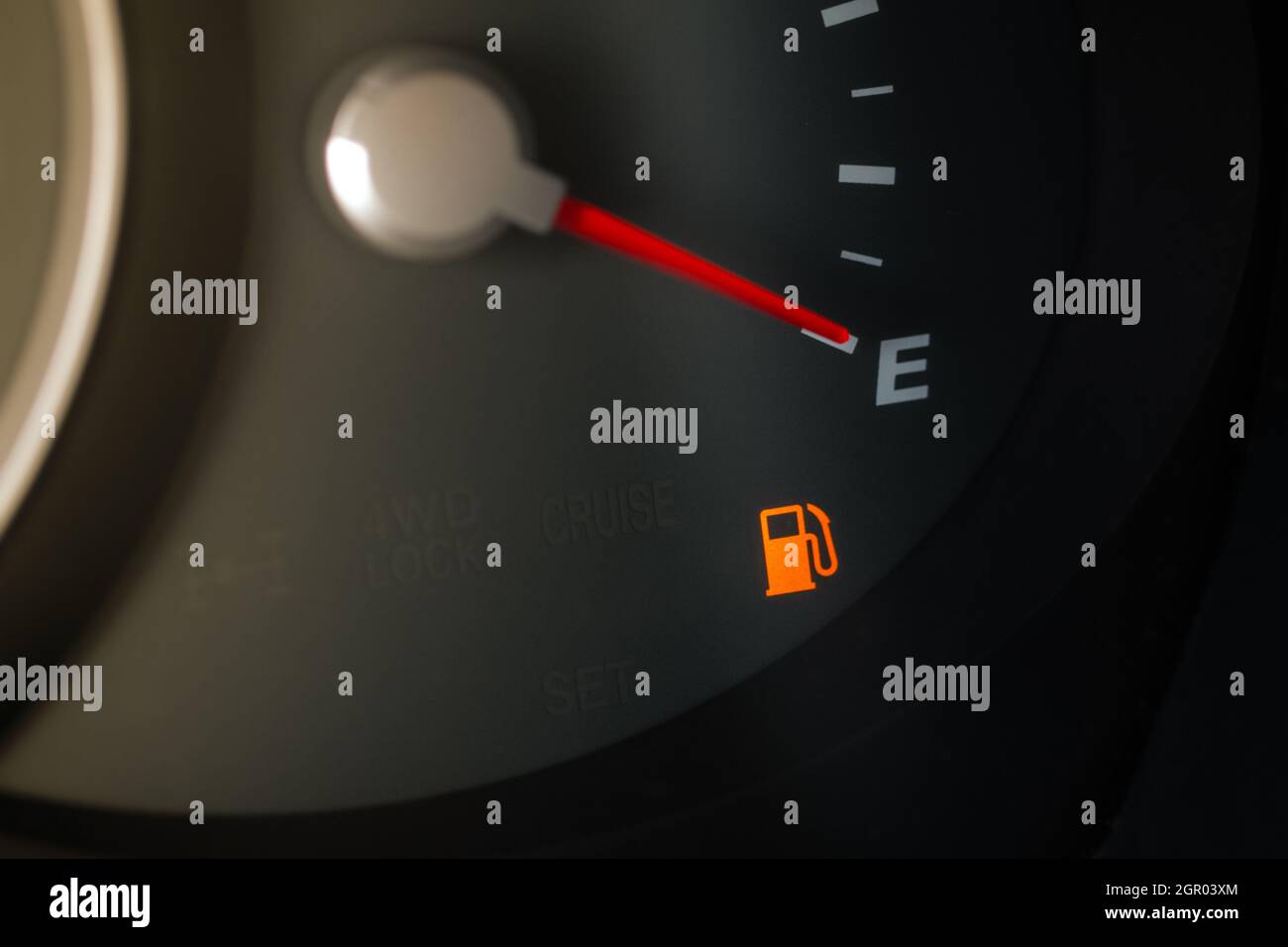 Fuel gauge shows empty tank. Ckose up view of fuel indicator Stock
