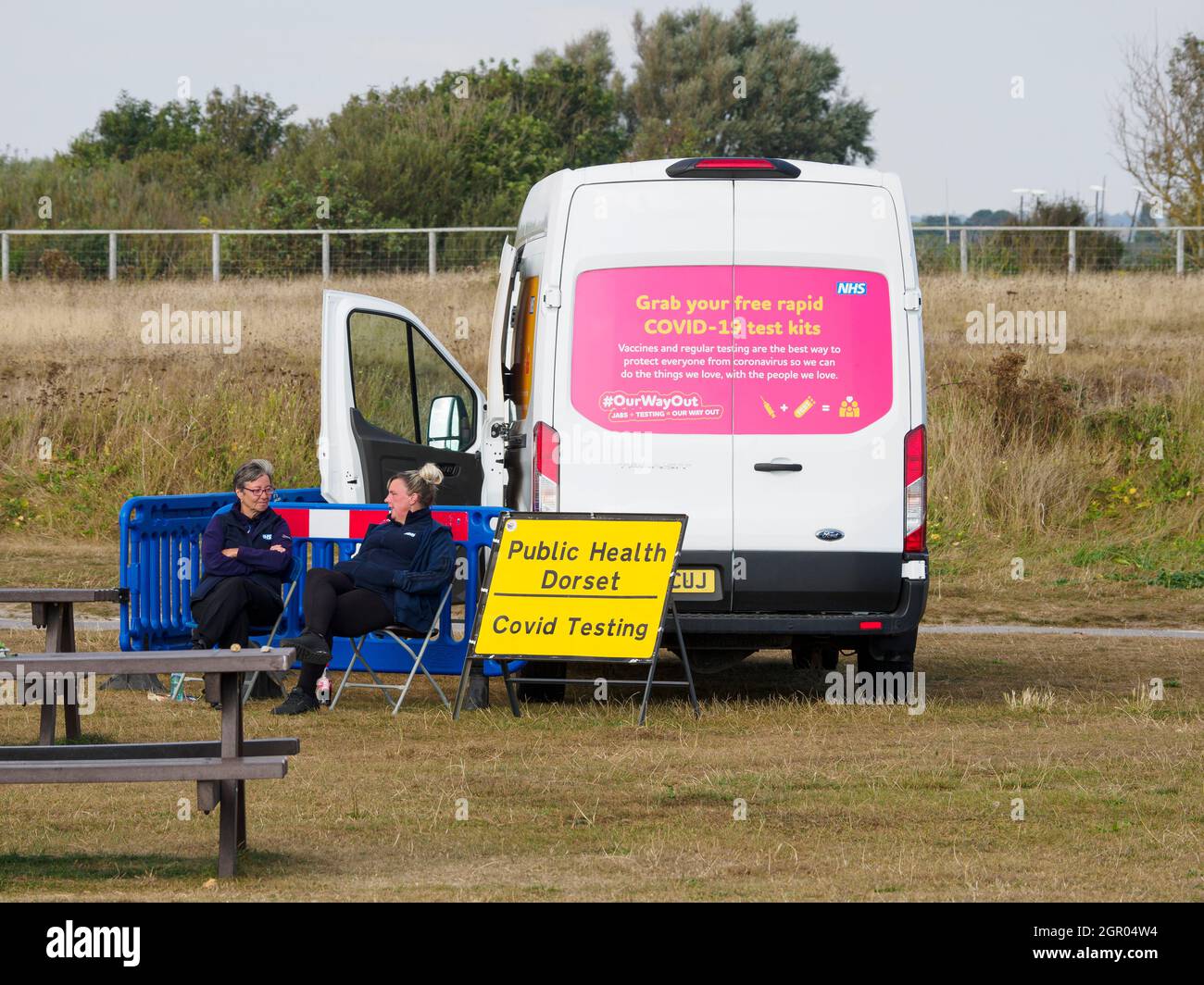 Mobile covid testing unit at Hengistbury head, a popular beach area in Dorset, UK Stock Photo