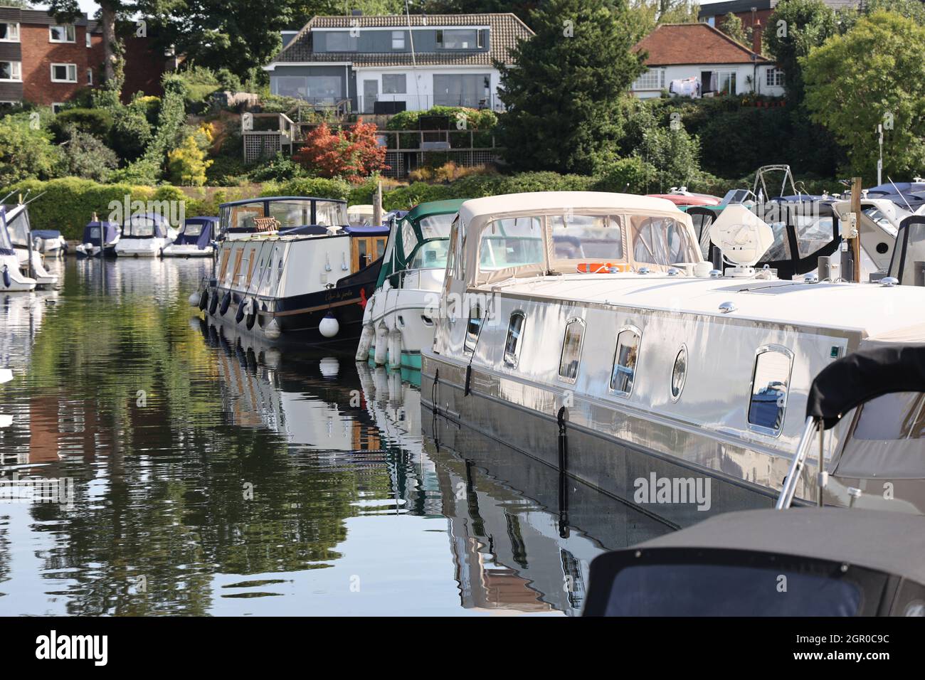 Narrowboats moored in Walton Marina on the river Thames, Surrey, UK