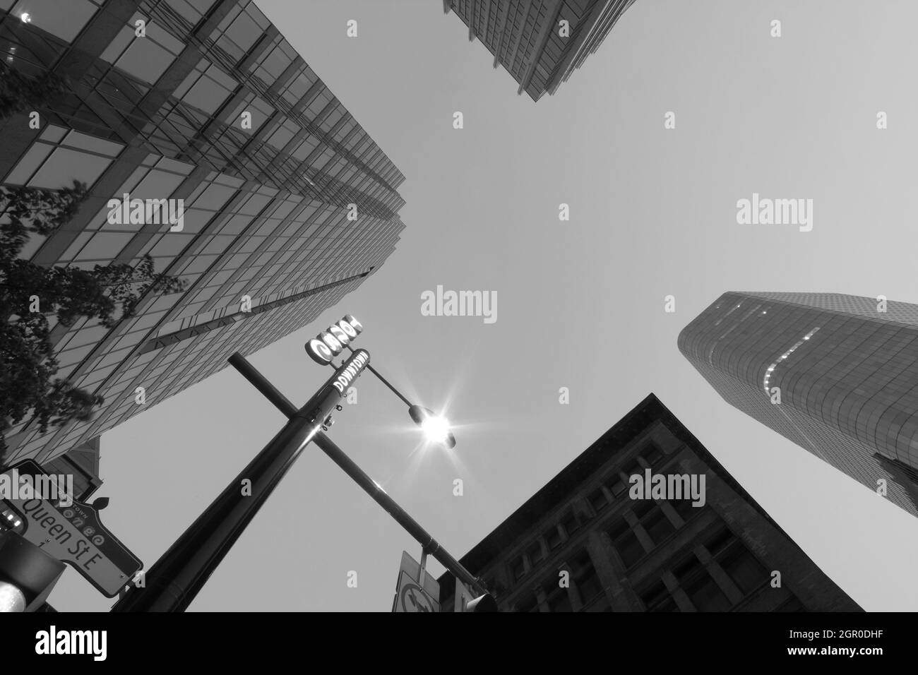 Wide-angle close-up of traffic signs on Yonge Street in downtown Toronto, black and white photo, no people. Stock Photo