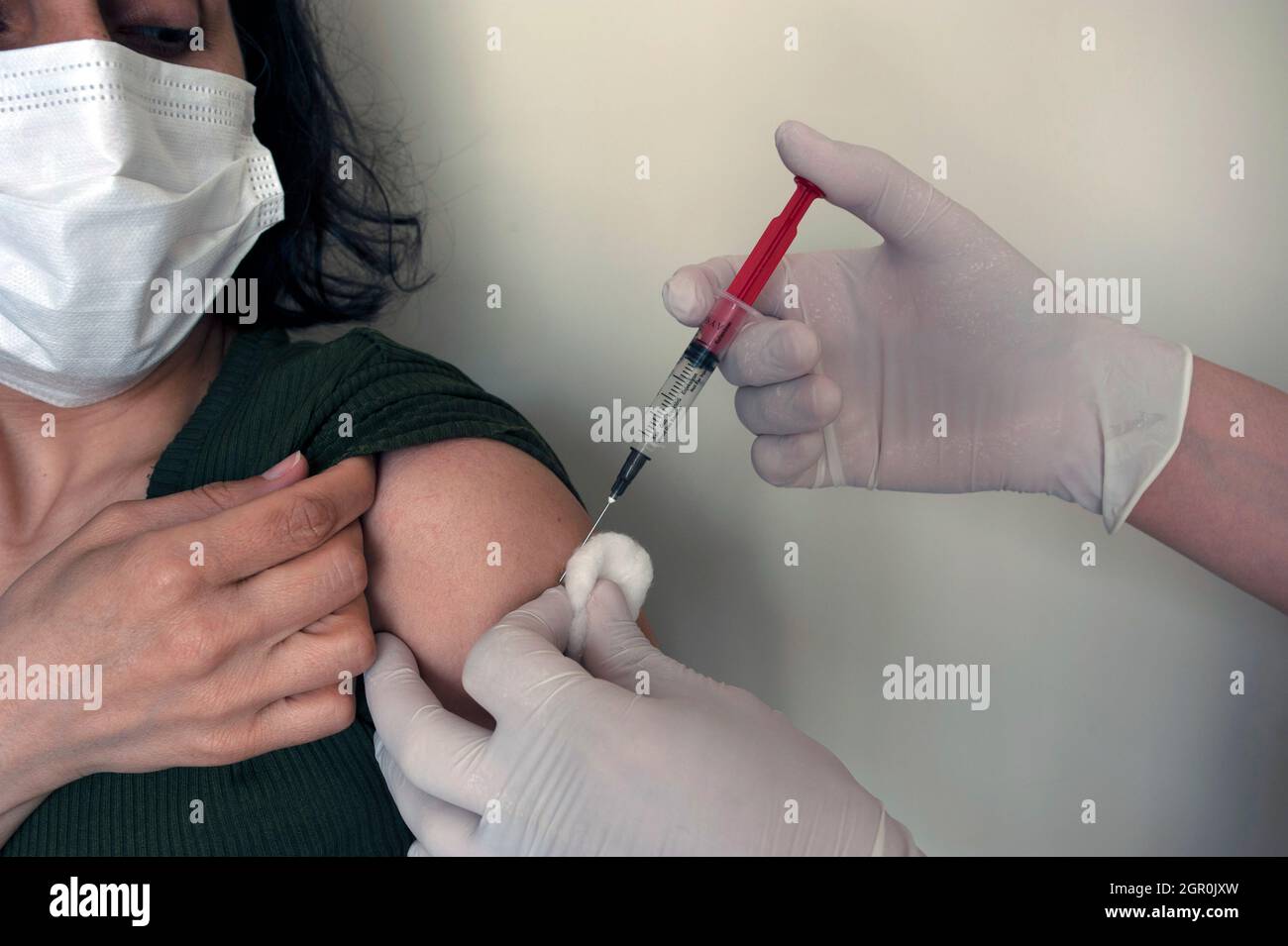 Doctor hand vaccinating male hi-res stock photography and images - Alamy