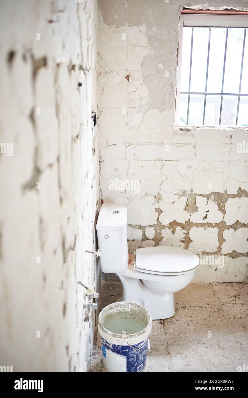 Toilet in a bathroom under construction Stock Photo Alamy