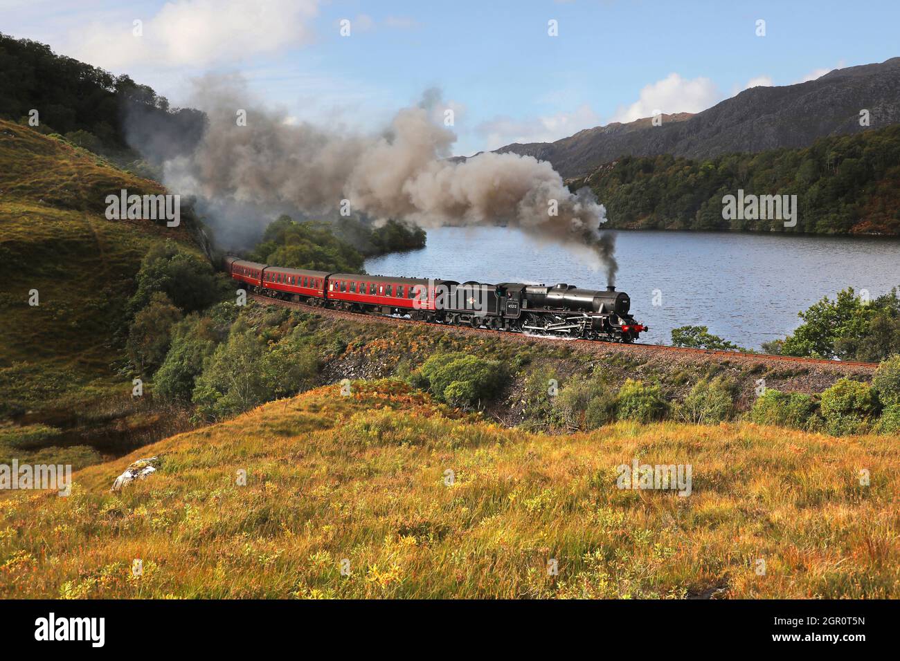 45212 catches some light as it heads along Loch Dubh with the returning morning Jacobite service on 29.9.21 Stock Photo