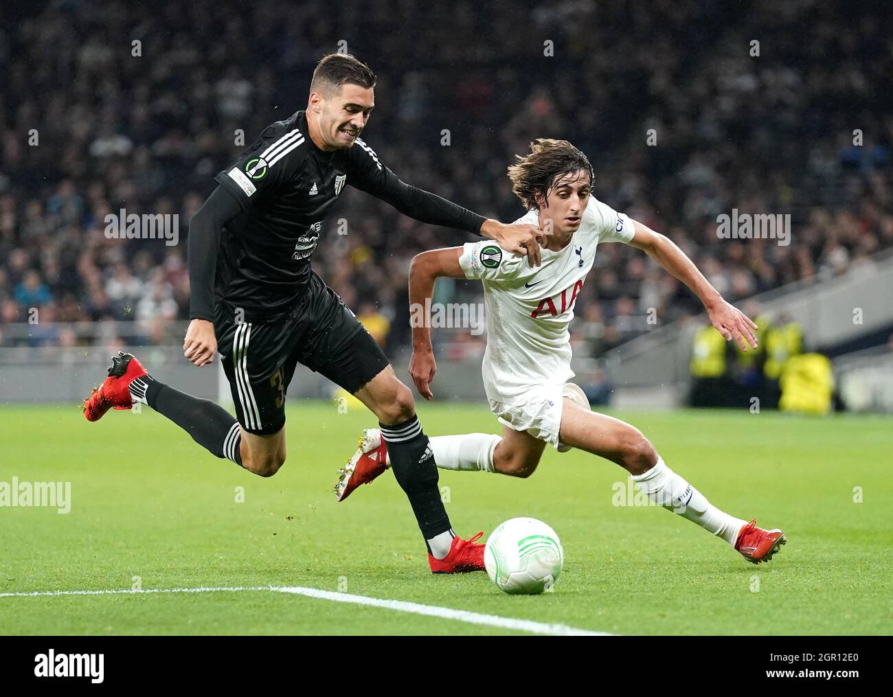 NS Mura's Ziga Kous (left) and Tottenham Hotspur's Bryan Gil battle for the ball during the UEFA Europa Conference League Group G match at the Tottenham Hotspur Stadium, London. Picture date: Thursday September 30, 2021. Stock Photo