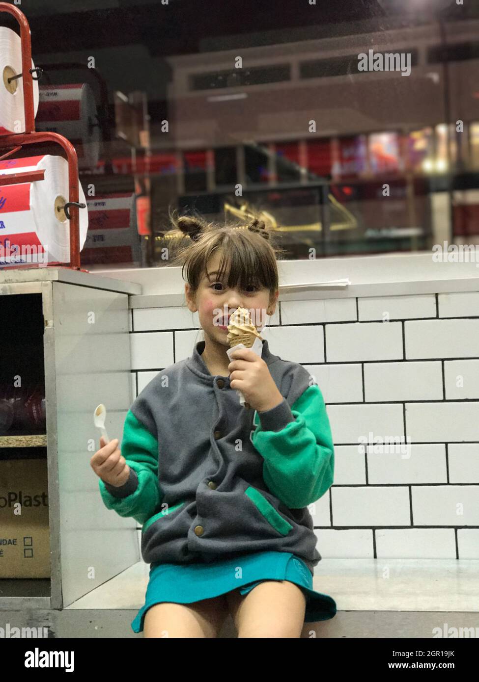 Portrait Of Little Girl Holding Food Stock Photo