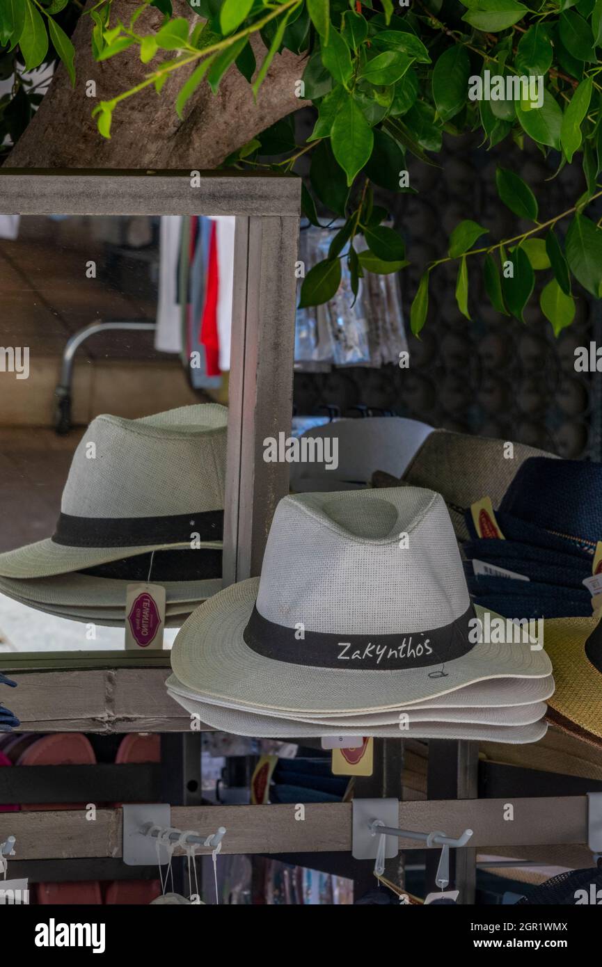 trilby or panama sun hat with zakynthos name band around the rim on sale at a zante gift or souvenir shop. Stock Photo