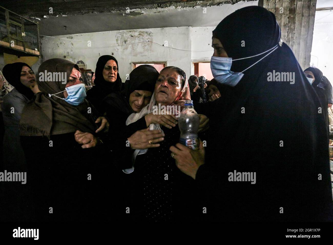 Gaza, Palestine. 30th Sep, 2021. Relatives mourning during the funeral of Palestinian Muhammad Abu Ammar, who was shot dead by Israeli soldiers at the border fence between Israel and Gaza, according to the Ministry of Health. Credit: SOPA Images Limited/Alamy Live News Stock Photo