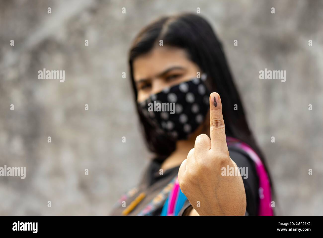 Selective Focus On Ink-marked Finger Of An Indian Woman With Safety Face Mask Stock Photo
