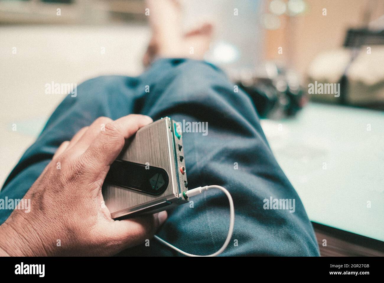 Man Using Walkman Audio Device Walkman hand hi-res stock photography and images - Alamy