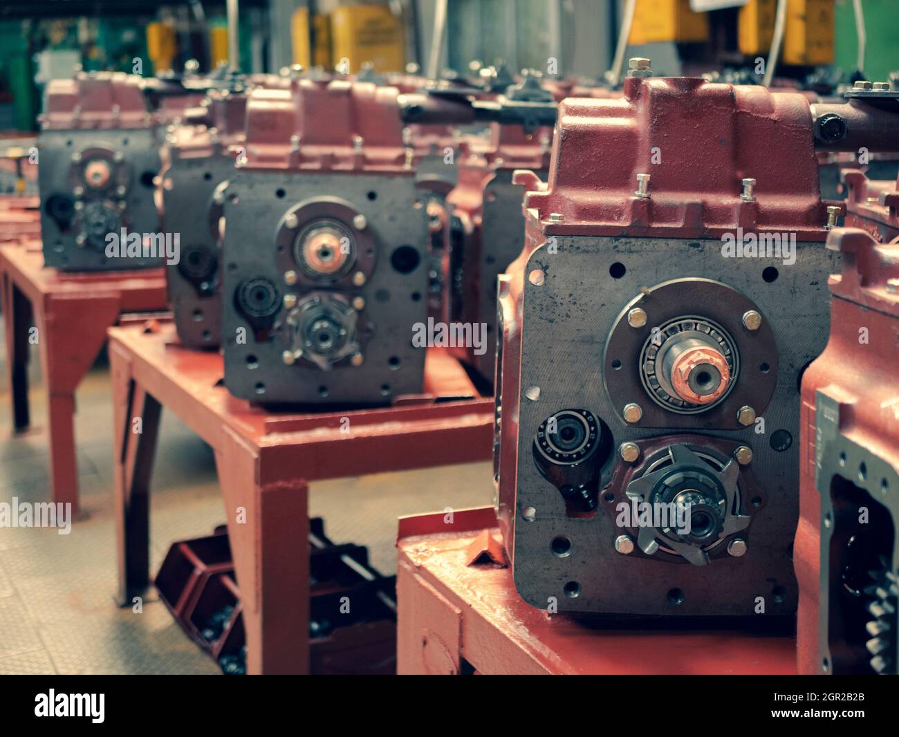 Transmission gearboxs in the shop of the tractor factory, selective focus. Gear boxes production