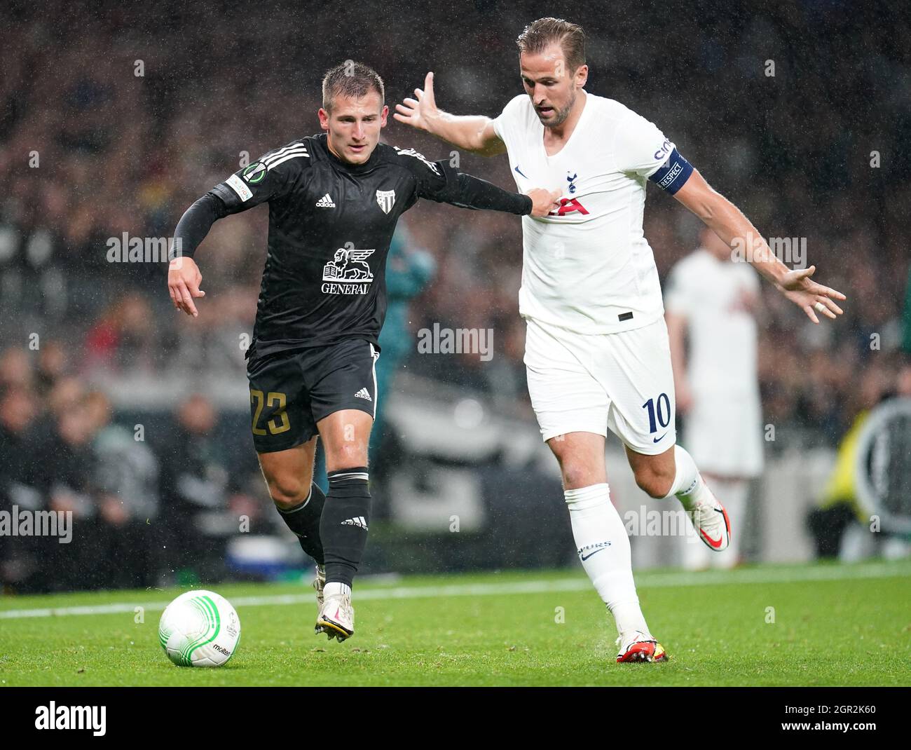 NS Mura's Klemen Sturm (left) and Tottenham Hotspur's Harry Kane battle for the ball during the UEFA Europa Conference League Group G match at the Tottenham Hotspur Stadium, London. Picture date: Thursday September 30, 2021. Stock Photo