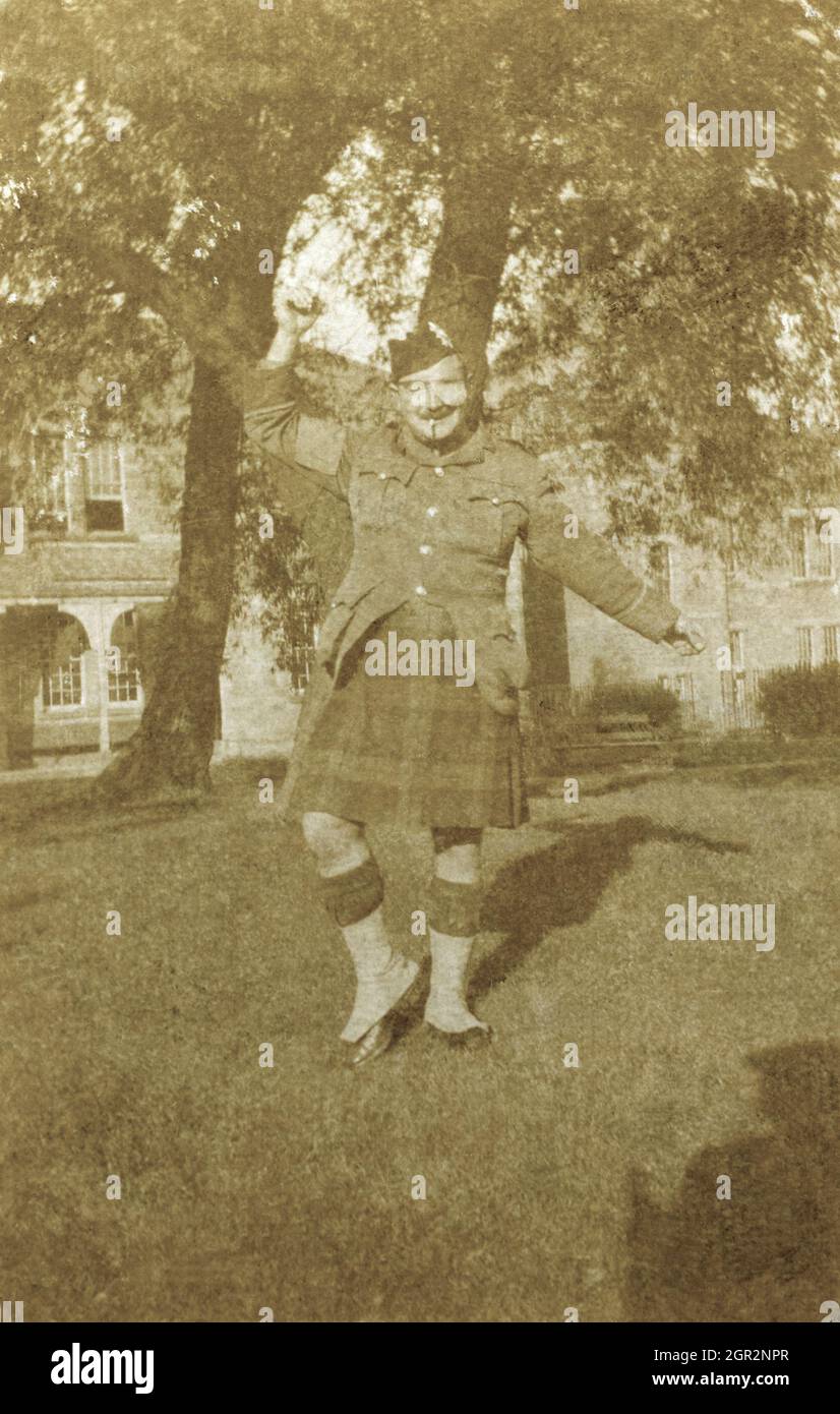 A portrait of a First World War Scottish infantry soldier doing a jig under a tree. Stock Photo