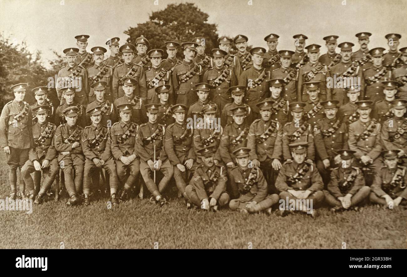 A First World War era group picture of Royal Artillery soldiers, taken in Colchester. The soldier seated in the front row holding a stick has a spur trade badge, inidcating he is a rough rider/riding instructor/remount trainer. The sargent seated in the front row, third from the right is rather showing off his farrier/shoesmith trade badge, a horse shoe. Stock Photo