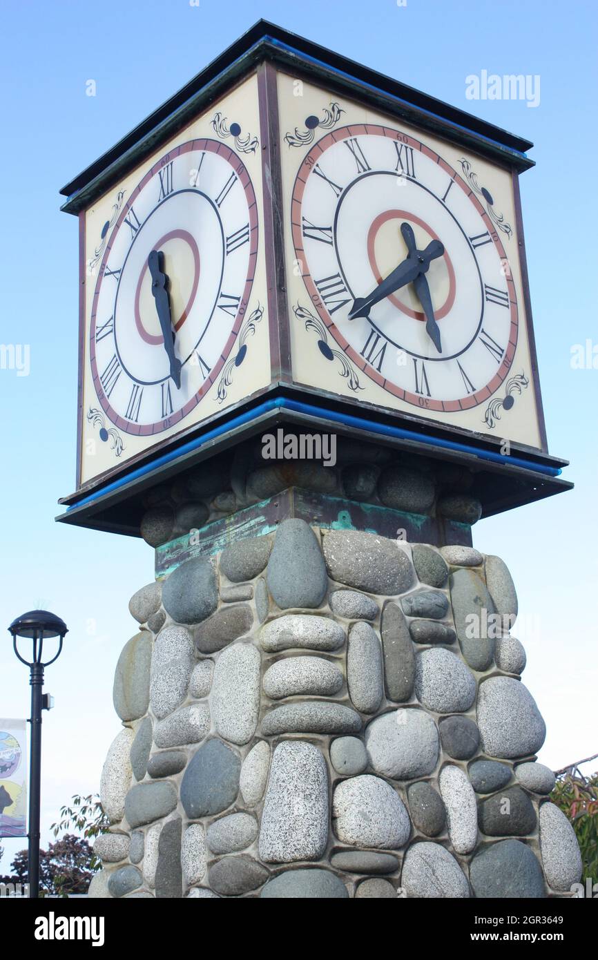Clock tower showing different times in Port Hardy, Vancouver Island