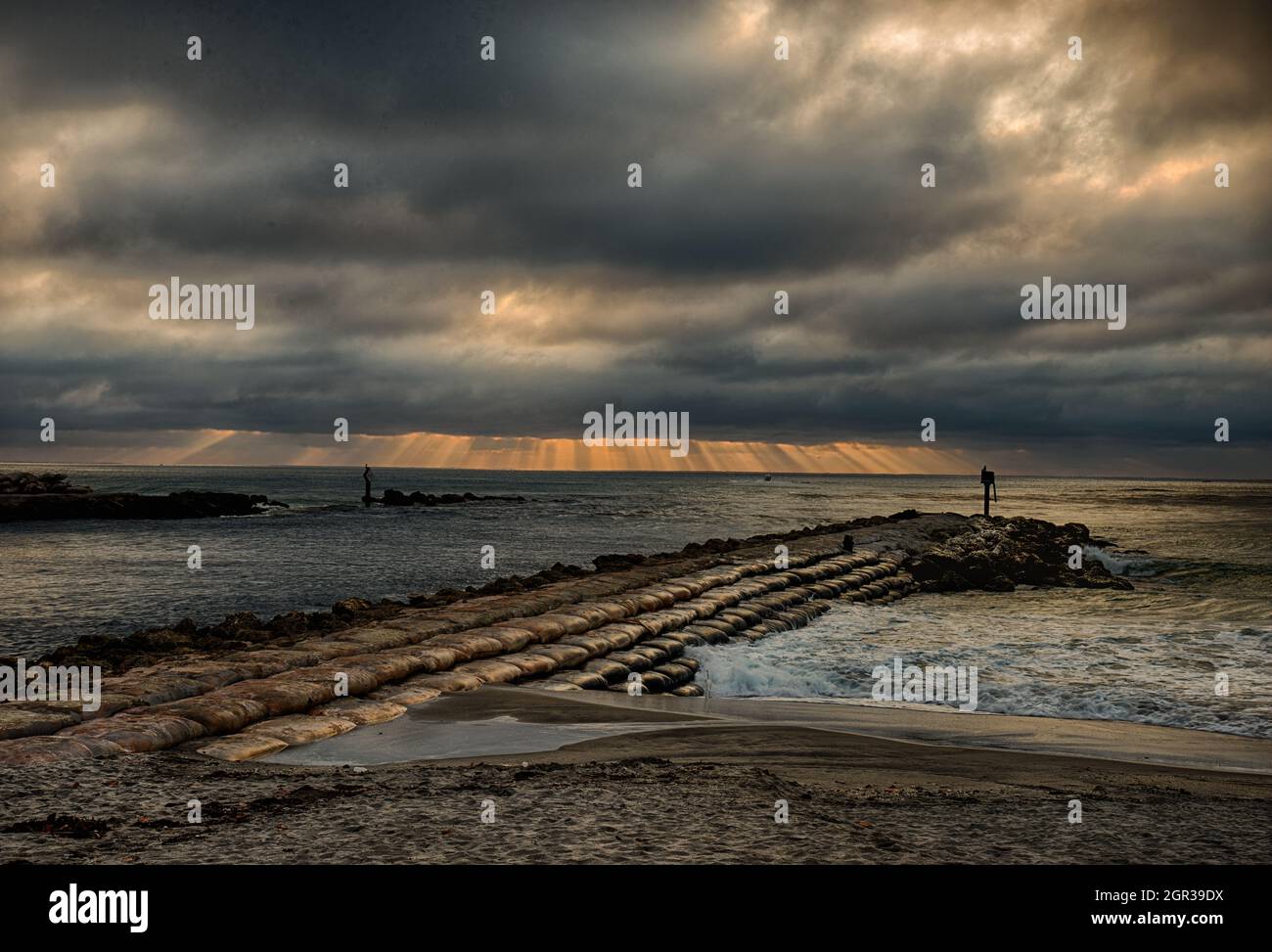 All quiet at the Jetty on the South side of the Boca Raton Inlet, as an incoming storm approaches Stock Photo