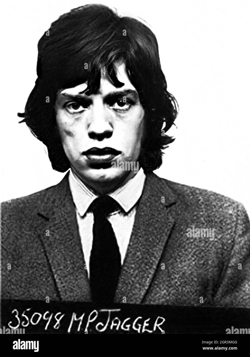 1967 , 12 february , Redlands, West Wittering , GREAT BRITAIN : The celebrated british Rock singer MICK JAGGER ( Sir Michael Philip Jagger , born   26 july 1943 ), member of group ROLLING STONES , when was arrested by Police for drug use during a party at guitarist Keith Richards' home. Police official mugshot , unknown photographer . - Mug sghot - MUG-SHOT - HISTORY - FOTO STORICHE  - MUSIC - MUSICA - cantante - COMPOSITORE - ROCK STAR - ROCKSTAR - ARRESTO - Arrestation - ARRESTATO DALLA POLIZIA - FOTO SEGNALETICA - mugshot - mug shot - rebel - ribelle  - HISTORY - FOTO STORICHE - PORTRAIT - Stock Photo