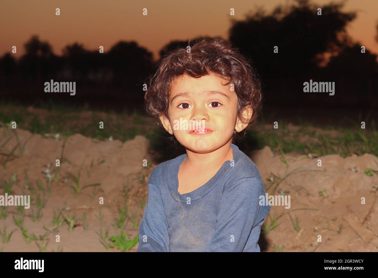 Indian Little Child Royalty Free Photo With Blur Background Of Sunset In India Stock Photo