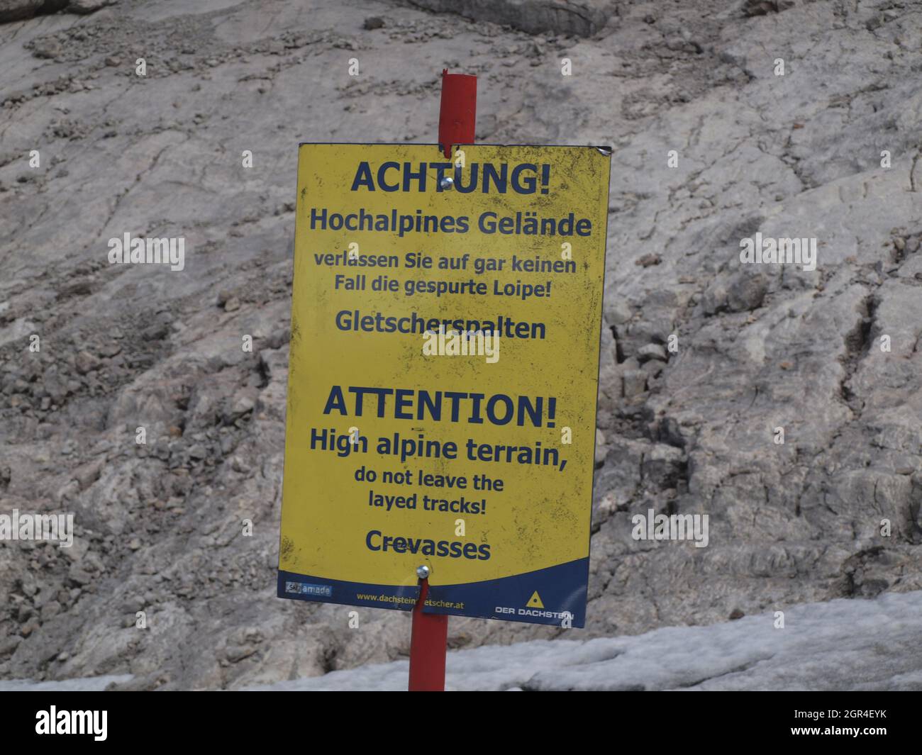 Attention sign of high alpine terrain Stock Photo - Alamy