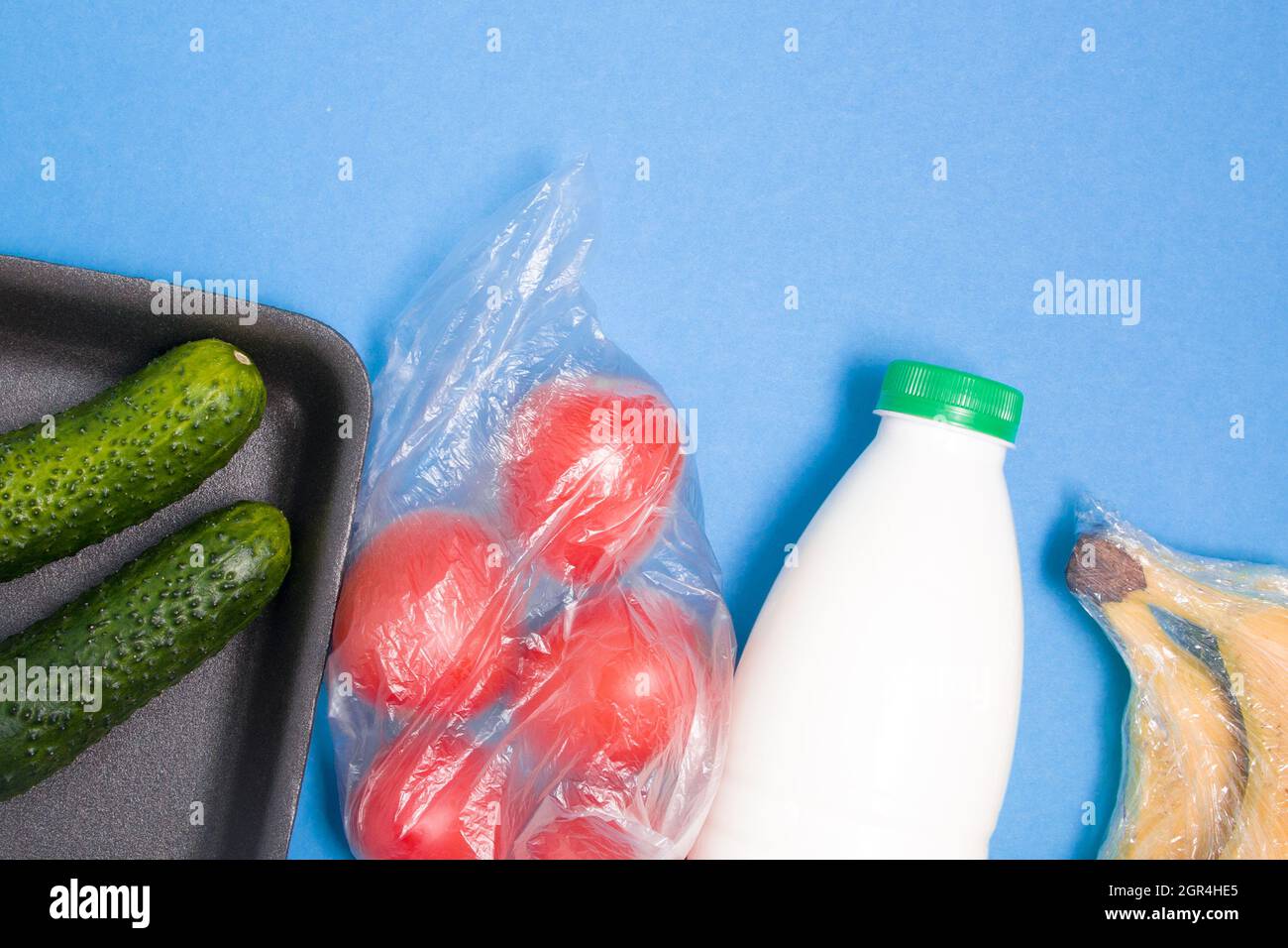 Different Types Of Plastic Packaging On A Blue Background, A Tray With