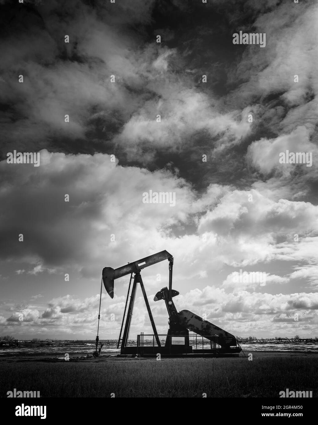 The pump-jack of an oil well sits in a field in Weld County, Colorado Stock Photo