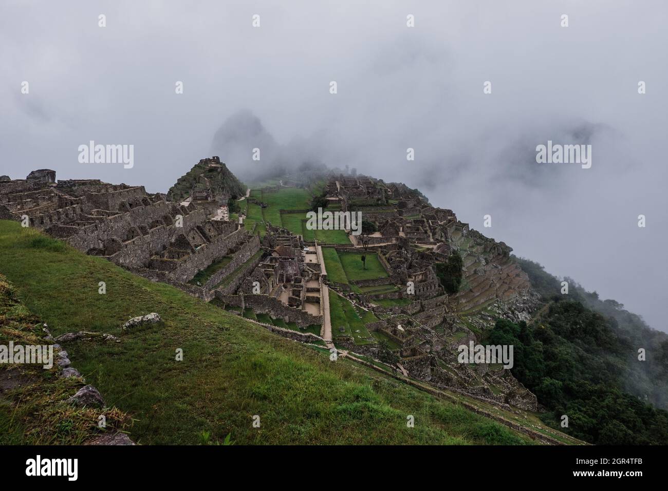 View Towards Machu Picchu On A Cloudy And Rainy Day Stock Photo